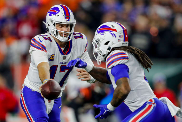 Allen hands the ball off to Cook for one of his six attempts on the night.